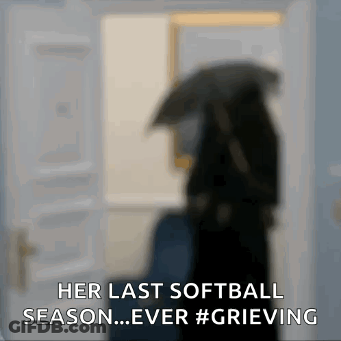 A Blurred Image Of A Woman Holding An Umbrella With The Words Her Last Softball Season Ever Grieving GIF