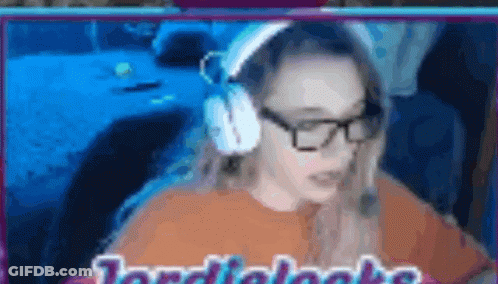 A Blurred Image Of A Woman Wearing Headphones And Glasses With The Words Jordi Looks Written On The Bottom GIF