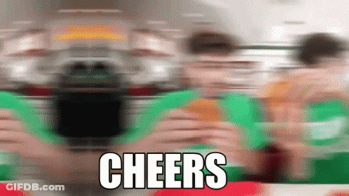 A Blurred Image Of People Eating Hamburgers With The Words Cheers Written On The Bottom GIF