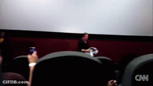 A Blurred Image Of People Watching A Movie With The Cnn Logo On The Bottom Left GIF