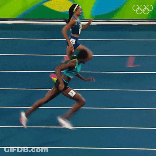 A Blurred Image Of Two Women Running On A Track With The Number 4 On The Bottom GIF