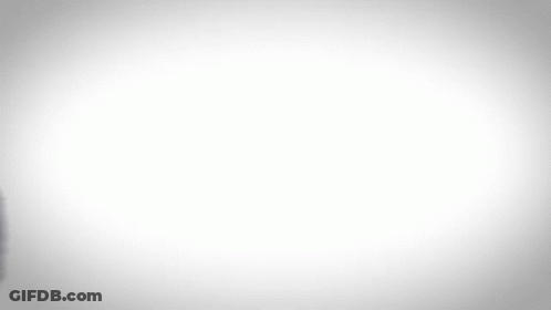 A Blurry Image Of A Man In A Blue Suit GIF
