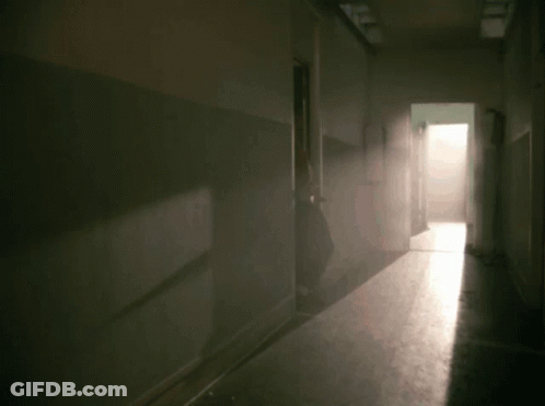 A Blurry Image Of A Man In A Red Jacket GIF