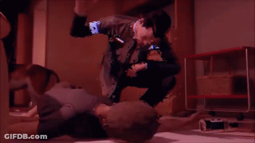 A Blurry Image Of A Man Kneeling On A Woman 'S Stomach GIF