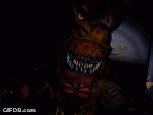 A Blurry Image Of A Monster With Sharp Teeth GIF