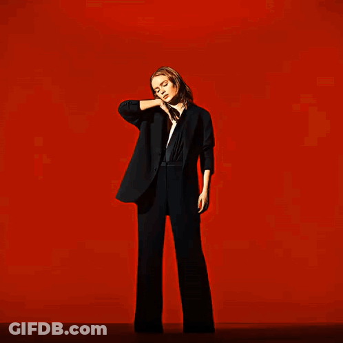A Blurry Image Of A Person 'S Face In A Red Background GIF