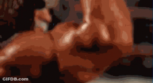 A Blurry Image Of A Person 'S Face With A Black Background GIF
