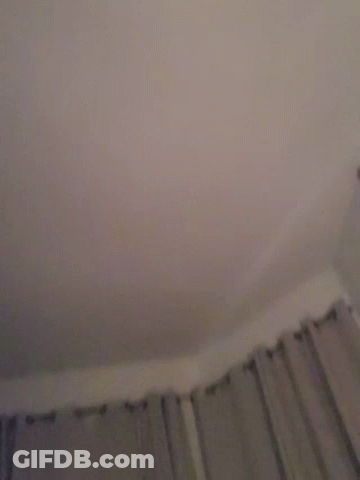A Blurry Image Of A Person 'S Face With A Pink Background GIF