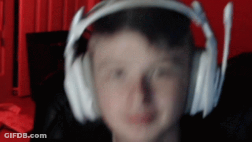 A Blurry Image Of A Person Wearing Headphones GIF