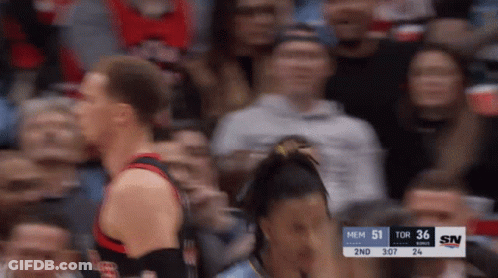 A Blurry Photo Of A Basketball Game With A Scoreboard That Says Mem 51 Tor 36 Sn GIF
