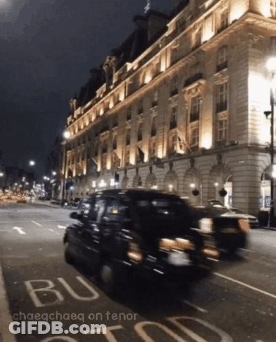 A Blurry Photo Of A Street At Night With The Words Chaeochaeq On Tenor GIF