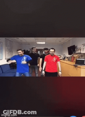 A Blurry Photo Of People Dancing In Front Of A Cse Sign GIF