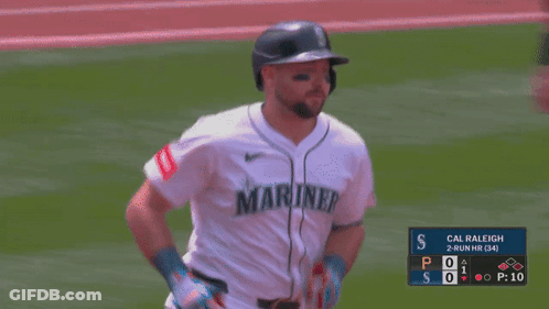 A Blurry Picture Of A Baseball Game With Cal Raleigh GIF