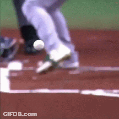 A Blurry Picture Of A Baseball Player Getting Ready To Catch The Ball GIF