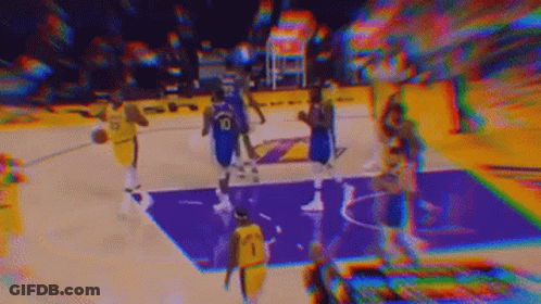 A Blurry Picture Of A Basketball Game Being Played On A Purple Court . GIF