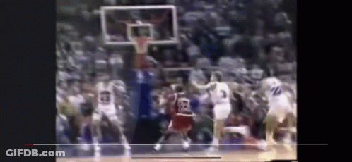 A Blurry Picture Of A Basketball Game With A Player Wearing A Jersey With The Number 23 On It . GIF