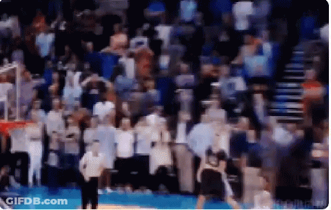 A Blurry Picture Of A Basketball Game With A Referee GIF