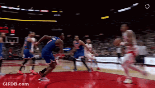 A Blurry Picture Of A Basketball Game With The Number 7 On The Back Of A Player 'S Jersey GIF