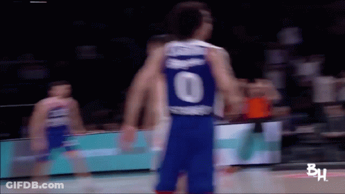A Blurry Picture Of A Basketball Player Wearing A Number 10 Jersey GIF