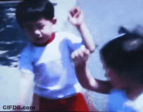 Blurry Picture Of Boy And Girl Playing GIF