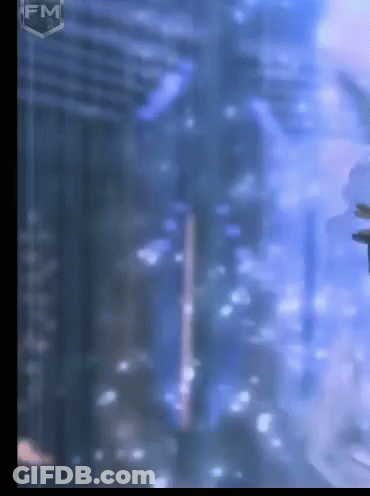 A Blurry Picture Of A Building With The Fm Logo On The Bottom GIF