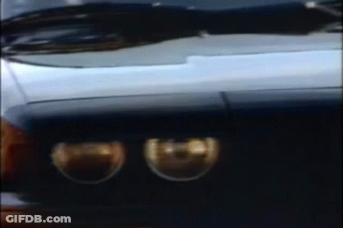 A Blurry Picture Of A Car 'S Headlights And Windshield GIF