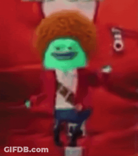A Blurry Picture Of A Cartoon Character With A Green Hat GIF