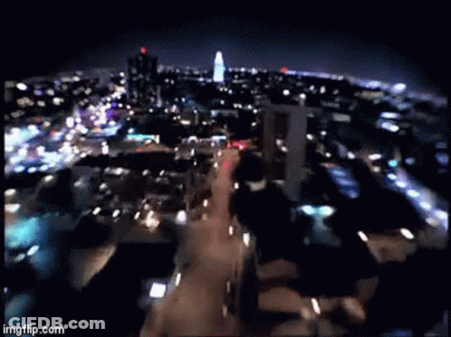 A Blurry Picture Of A City At Night With The Words Imgflip.com On The Bottom Right GIF
