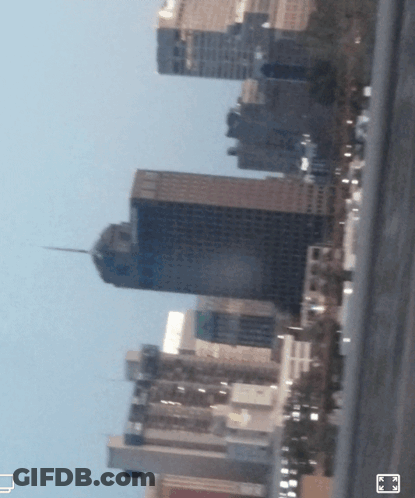 A Blurry Picture Of A City Skyline With A Few Buildings Visible GIF