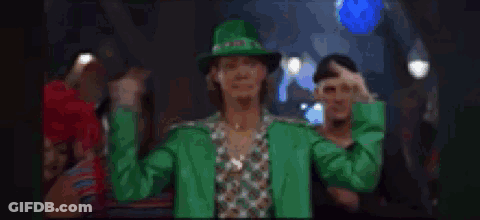 A Blurry Picture Of A Crowd Of People Dancing In A Bar . GIF