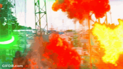 A Blurry Picture Of A Fire With A Green Light In The Foreground GIF