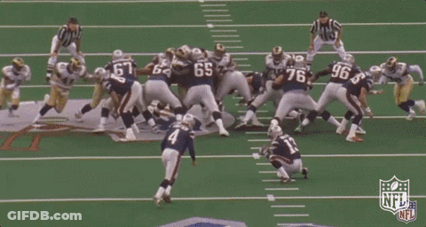 A Blurry Picture Of A Football Field With The Nfl Logo In The Foreground . GIF