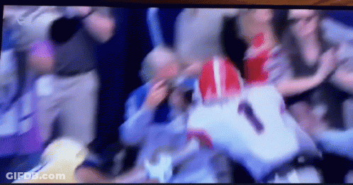 A Blurry Picture Of A Football Game With The Number 1 On The Back GIF