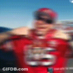 A Blurry Picture Of A Football Player Wearing A Red Jersey With The Number 28 On It GIF