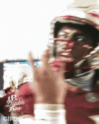 A Blurry Picture Of A Football Player With A Double Fries Sign In The Corner GIF