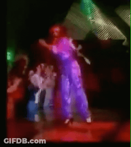 A Blurry Picture Of A Group Of People Dancing In A Club GIF