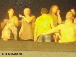 A Blurry Picture Of A Group Of People Standing Together GIF