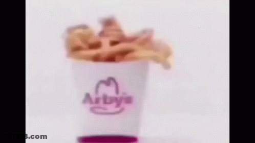 A Blurry Picture Of A Hamburger On A White Surface . GIF