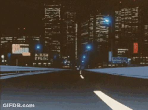 A Blurry Picture Of A Highway At Night With A Sign That Says U.s. Army GIF
