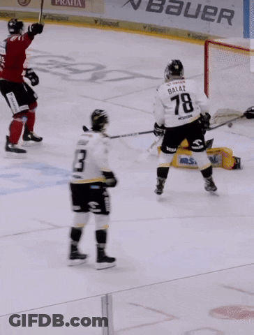 A Blurry Picture Of A Hockey Player In A Red Uniform GIF