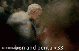 A Blurry Picture Of A Man And A Woman With The Words Bun And Penta < 33 GIF