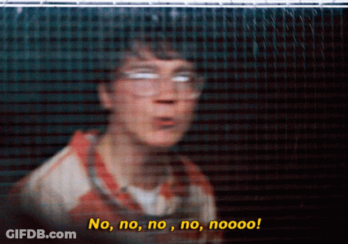A Blurry Picture Of A Man Behind A Fence With The Words No No No No Nooo GIF