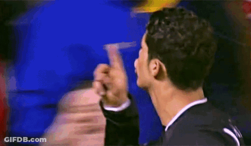 A Blurry Picture Of A Man Giving A Middle Finger To Another Man GIF