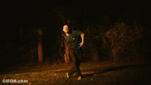 A Blurry Picture Of A Man Giving The Thumbs Up GIF