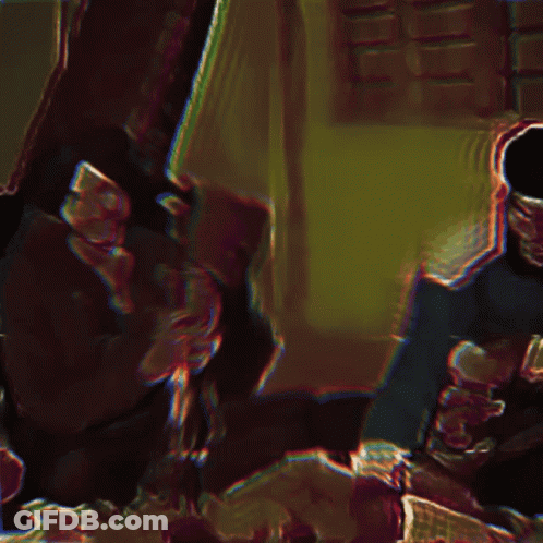 A Blurry Picture Of A Man In A Black Hat GIF