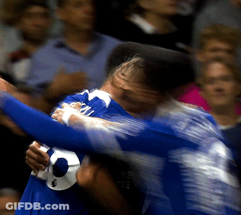 A Blurry Picture Of A Man In A Blue Jersey With The Number 2 On It GIF