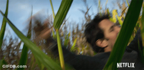 A Blurry Picture Of A Man In A Field With A Netflix Logo In The Corner GIF