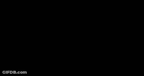 A Blurry Picture Of A Man In A Gas Mask Standing Next To Another Man GIF
