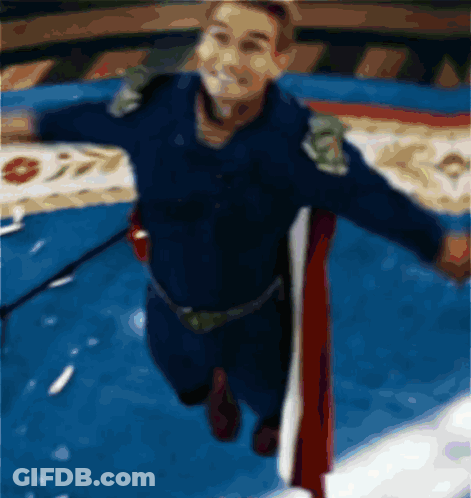 A Blurry Picture Of A Man In A Superhero Outfit GIF