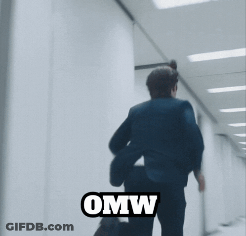 A Blurry Picture Of A Man Jumping With The Word Omw Below Him GIF